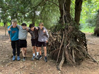 Four children shelter building at XUK Camps