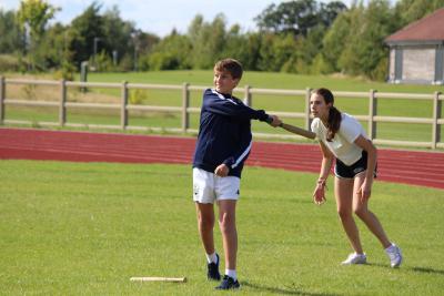 two children playing rounders at XUK summer camp