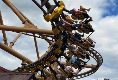 Children on a rollercoaster while on a trip with XUK Camps