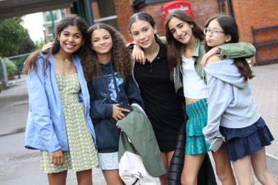 Group of teenage girls smiling at summer camp