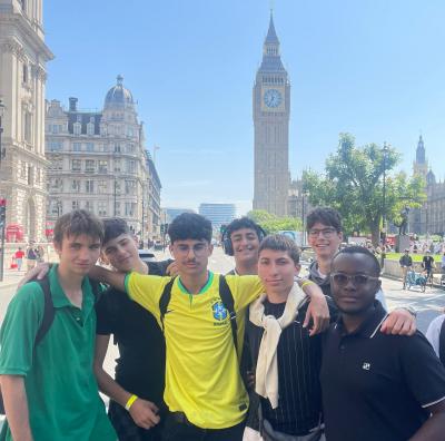 Group of teenage boys in front of the houses of parliment while on a trip with XUK Camps