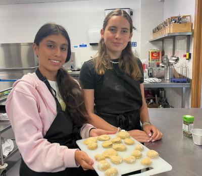 two teenage girls learning how to make ravioli at XUK cookery camp