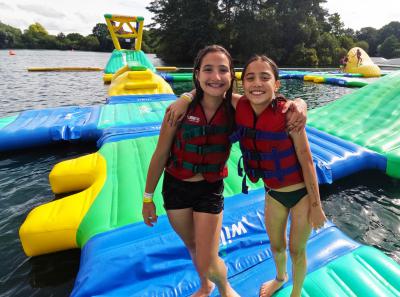 Two teenage girls on aqua park trip with XUK Camps