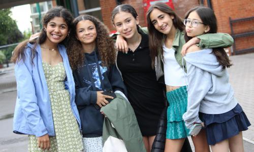 Group of teenage girls smiling at english summer school