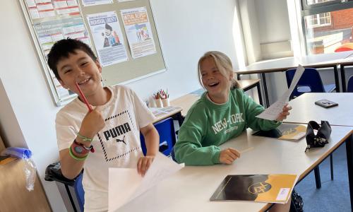 Two children laughing during their lesson at english summer school